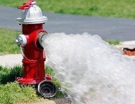 Fire-hydrant-with-water-blur